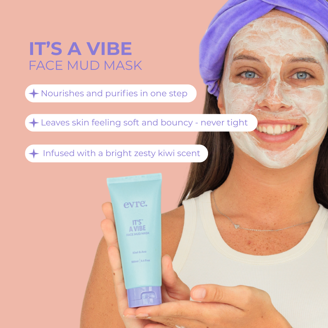 Girl applying face mud mask with product packaging on a pink background