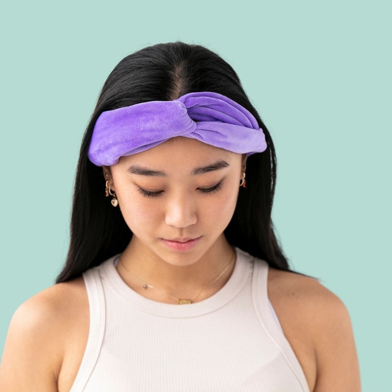 Skincare headband purple on girls head