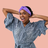 Girl posing with skincare headband in robe